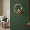Designerski kinkiet złoty LED, złota obręcz ze złotą figurą AMICI LED 27 cm perfektmarket.webp